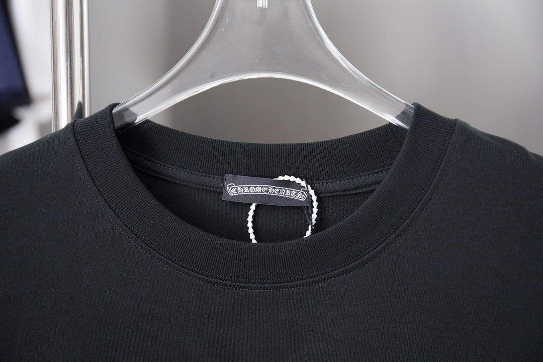 Black crew-neck T-shirt neckline with ribbed collar and brand neck tag