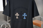 Black T-shirt back graphic with leopard and blue cross patches under dark text