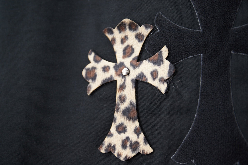 Black T-shirt with leopard-print cross applique and dark stitched outline