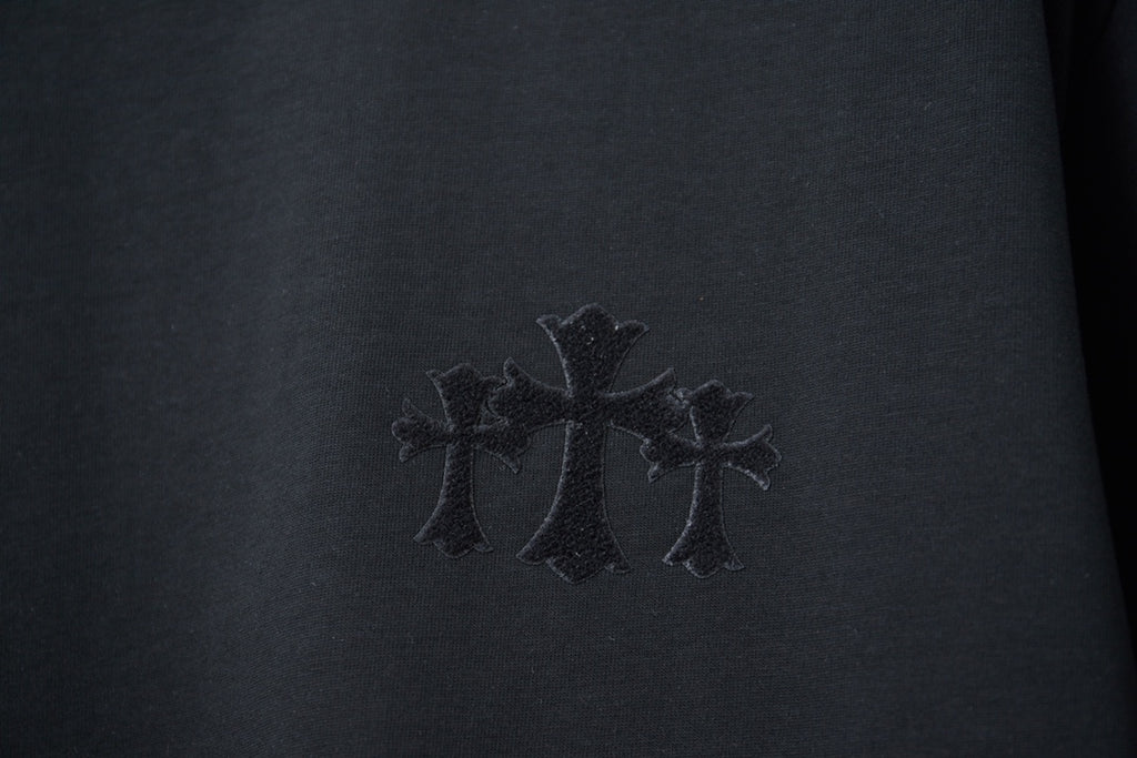 Black T-shirt chest embroidery with three cross shapes in dark thread