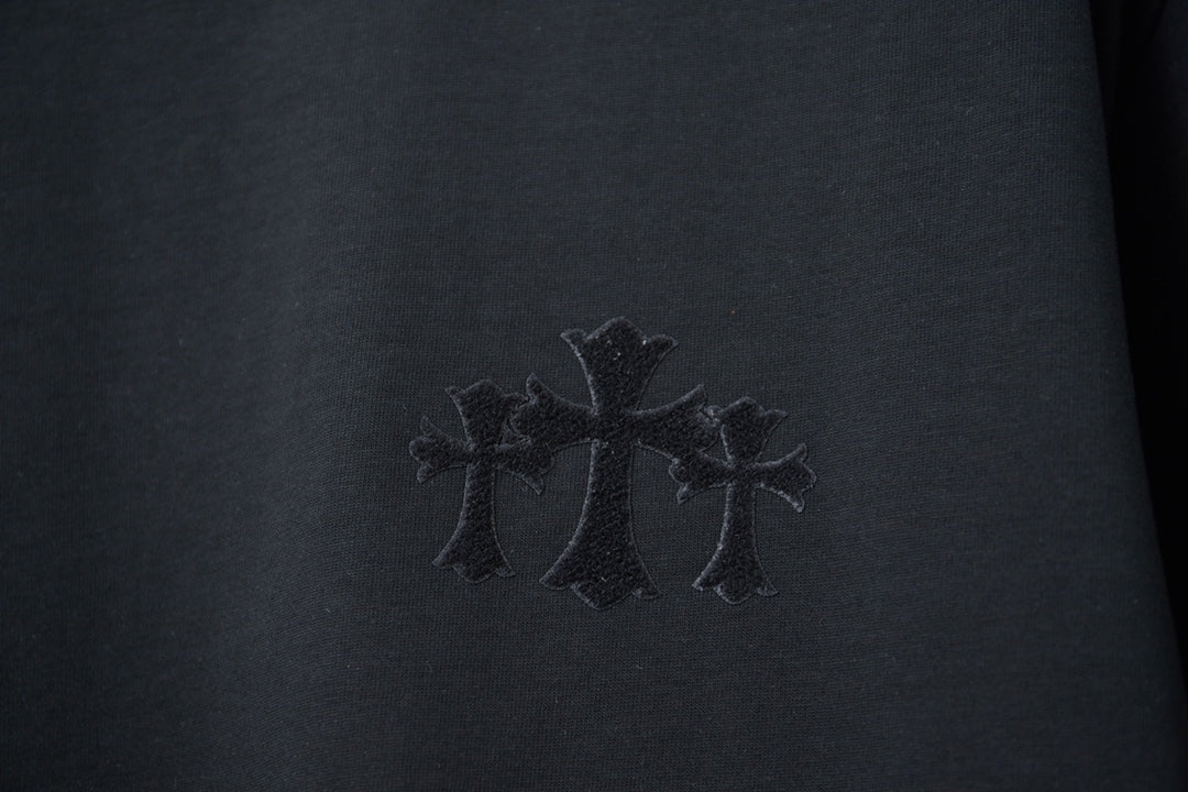 Black T-shirt chest embroidery with three cross shapes in dark thread