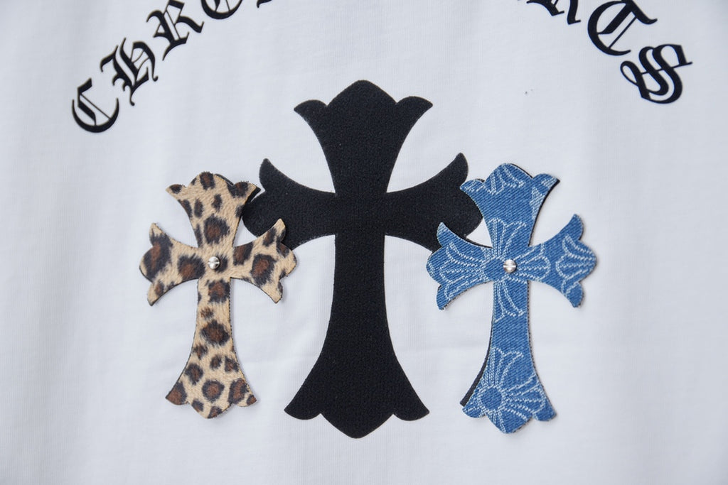 Close-up of white short-sleeve T-shirt back graphic with black and blue cross emblems