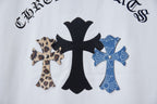 Close-up of white short-sleeve T-shirt back graphic with black and blue cross emblems