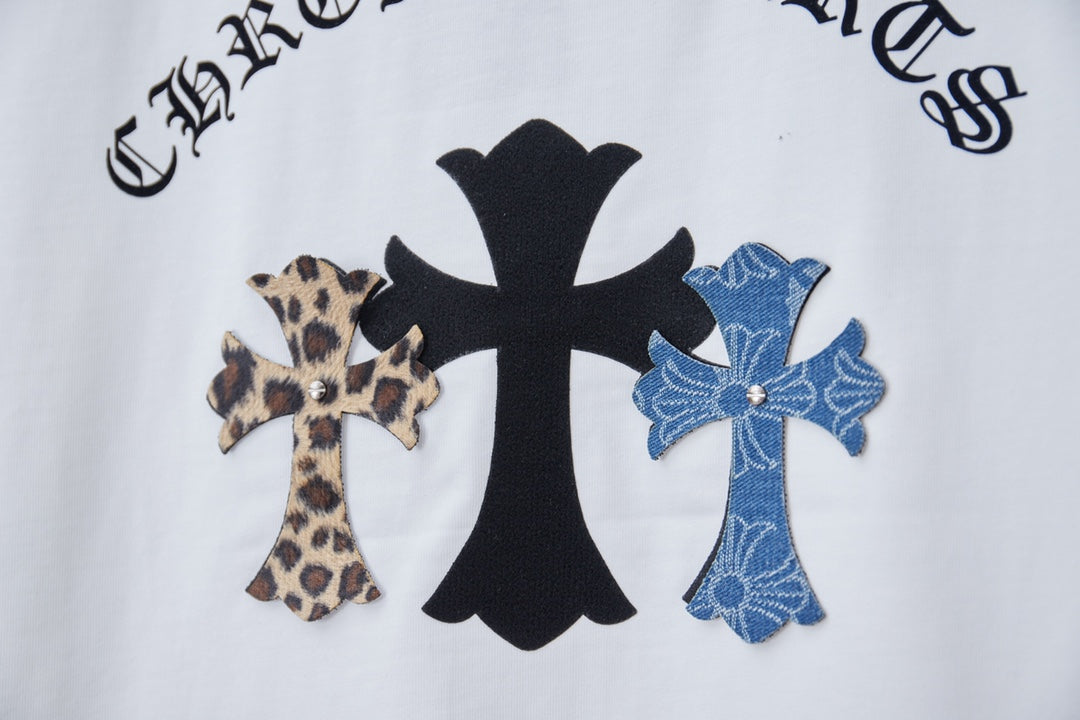 Close-up of white short-sleeve T-shirt back graphic with black and blue cross emblems