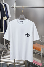 White short-sleeve T-shirt with small black graphic emblem on left chest