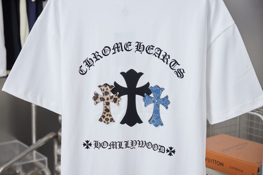 White short-sleeve T-shirt with large back graphic showing black and blue crosses