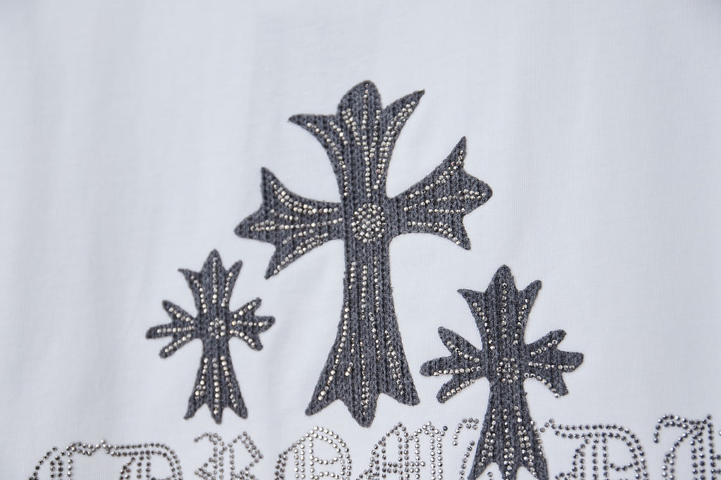 White short-sleeve T-shirt with large dark cross and star embellishment graphic