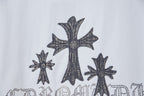 White short-sleeve T-shirt with large dark cross and star embellishment graphic