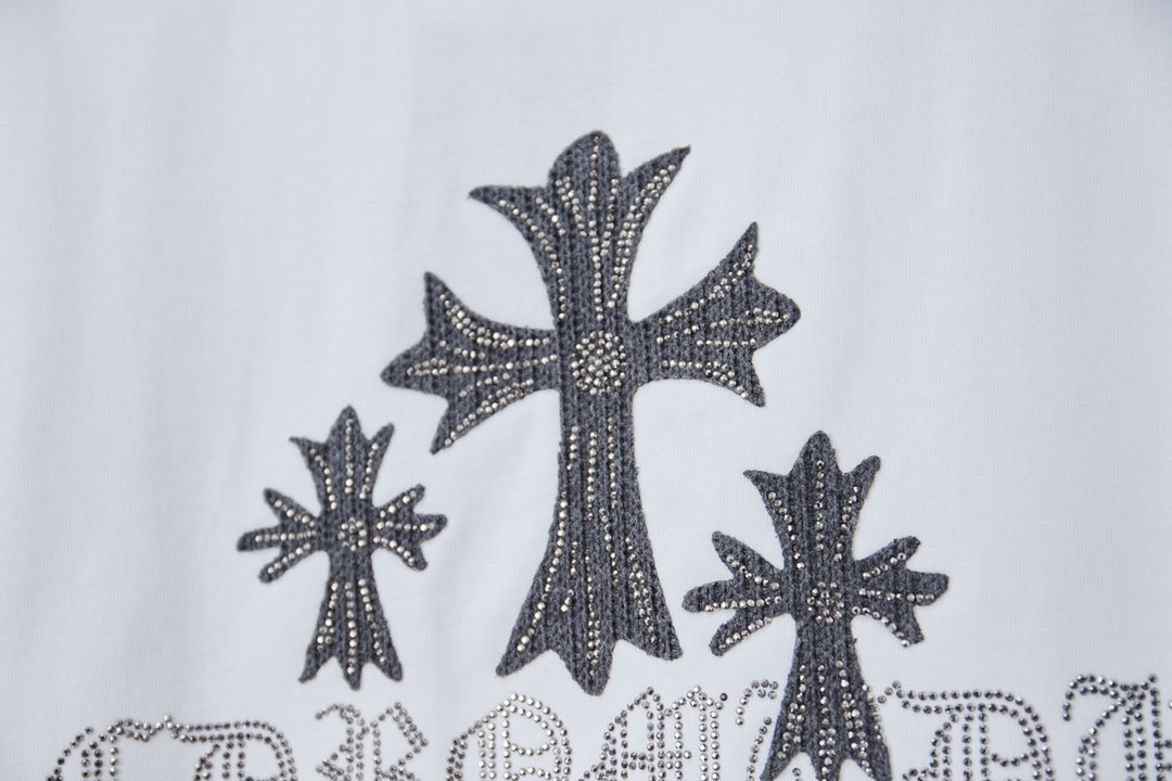 White short-sleeve T-shirt with large dark cross and star embellishment graphic