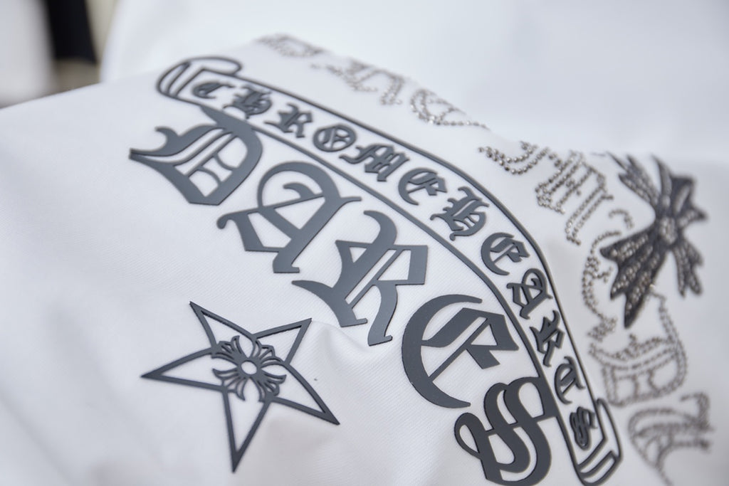 White short-sleeve T-shirt with dark star, cross, and lettering graphic at front