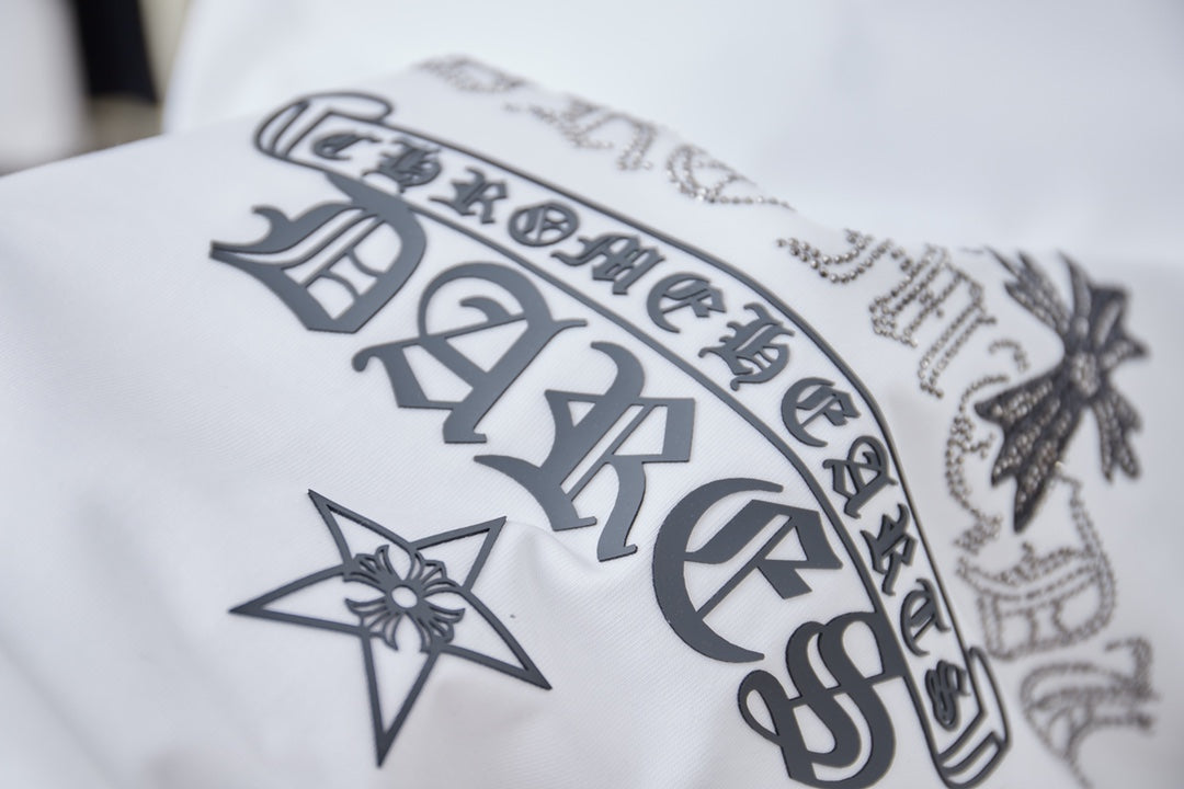 White short-sleeve T-shirt with dark star, cross, and lettering graphic at front