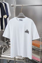 White short-sleeve T-shirt with dark star and cross graphic on the chest