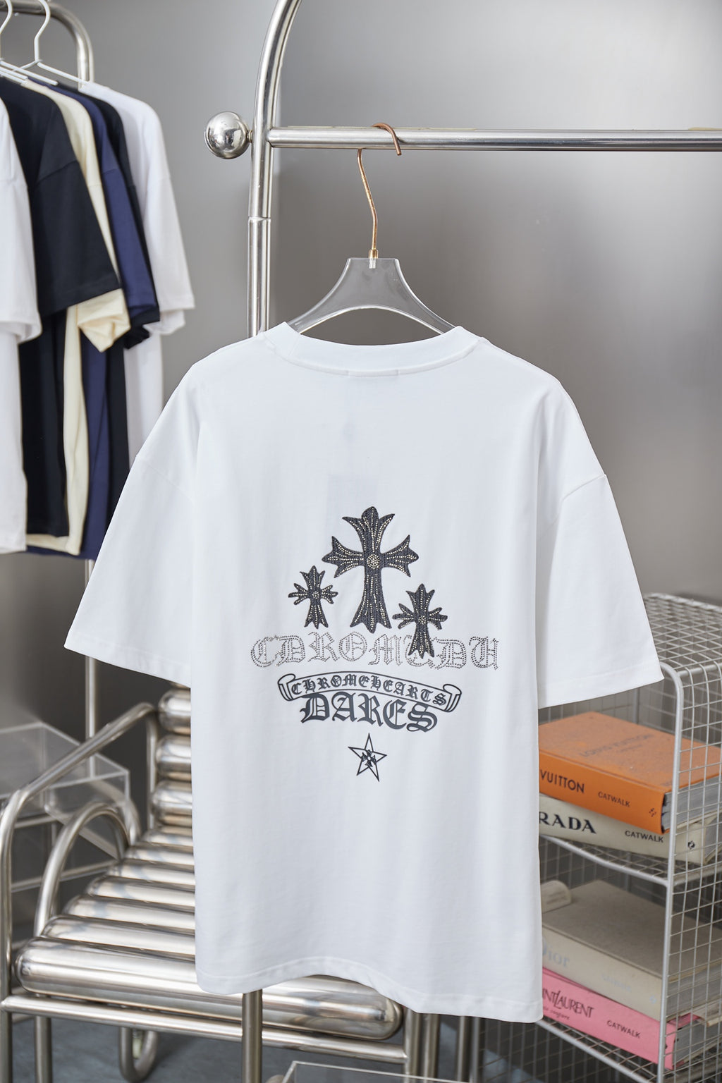 White short-sleeve T-shirt, back view, with large dark cross and star graphic