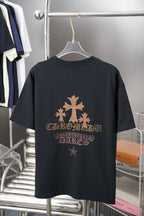 Graphic T-shirt back with large gold tree, star details, and ornate lettering