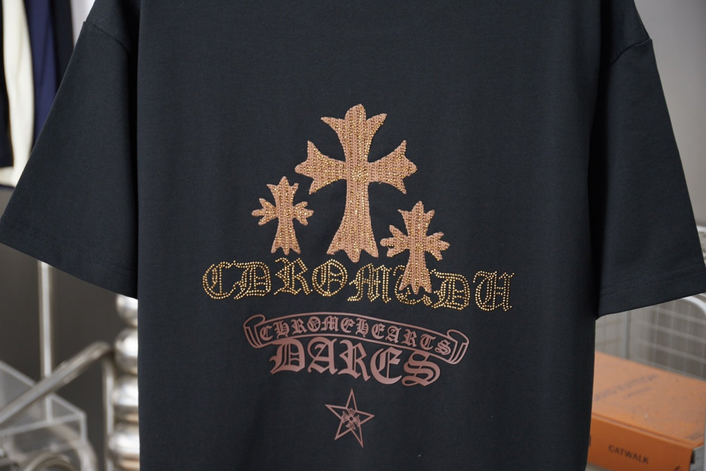 Graphic T-shirt back print with gold emblem, ornate lettering, and star