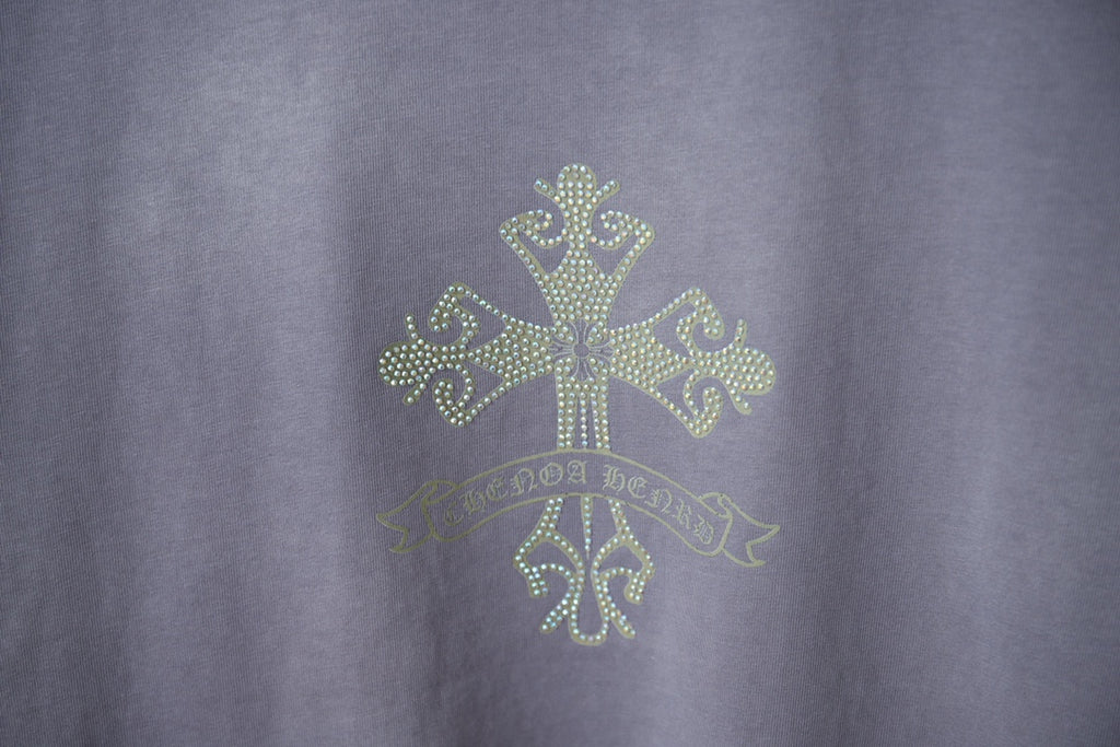 Dusty blue T-shirt with rhinestone cross and decorative motif at the upper chest
