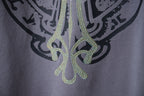 Dusty blue T-shirt rhinestone lower graphic with curving decorative details