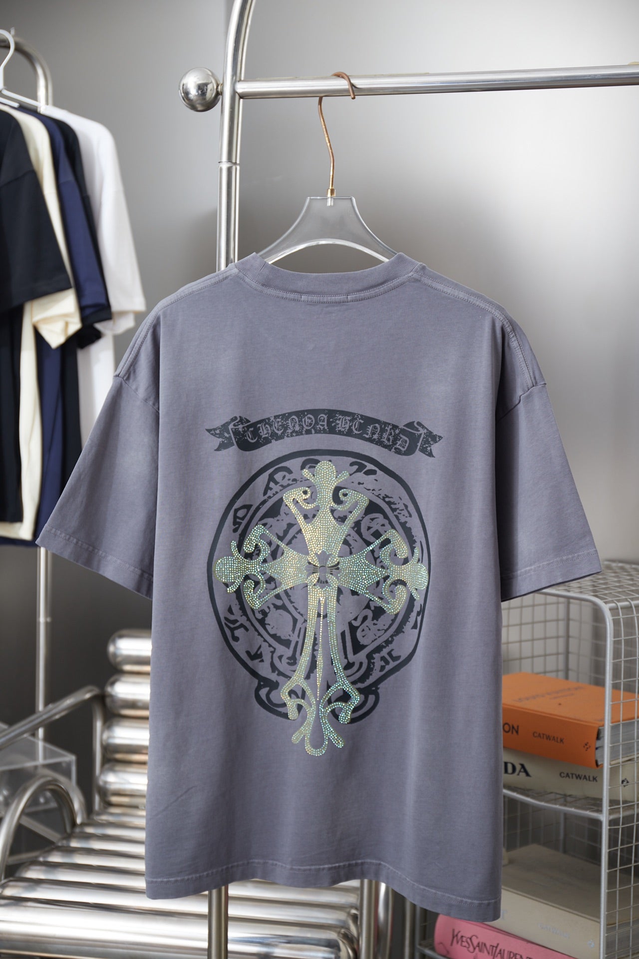 Crewneck short-sleeve T-shirt in dusty blue with large rhinestone back graphic