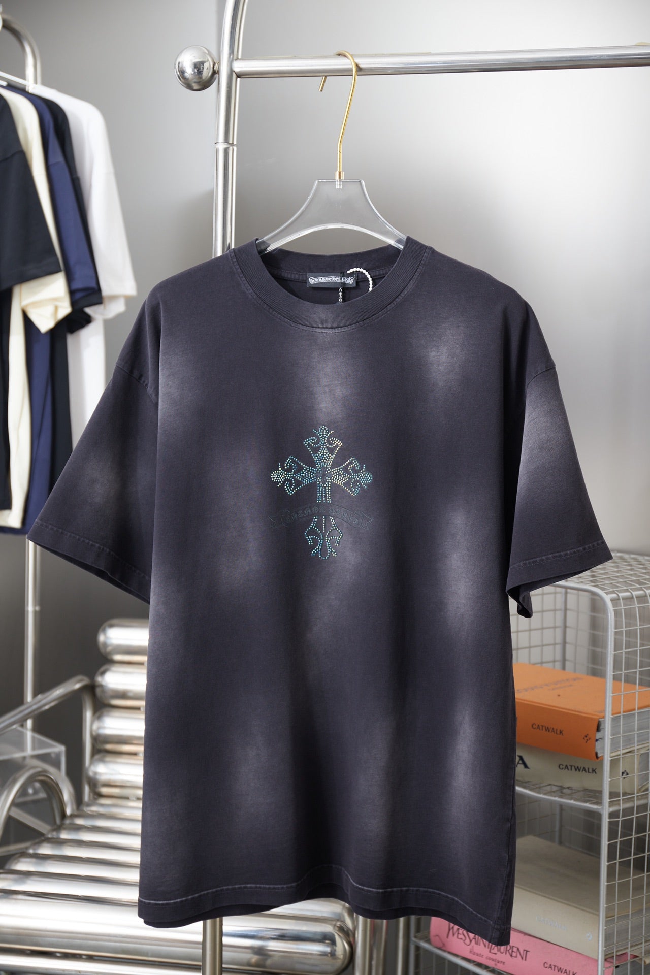 Dark navy short-sleeve T-shirt with small rhinestone cross graphic on chest
