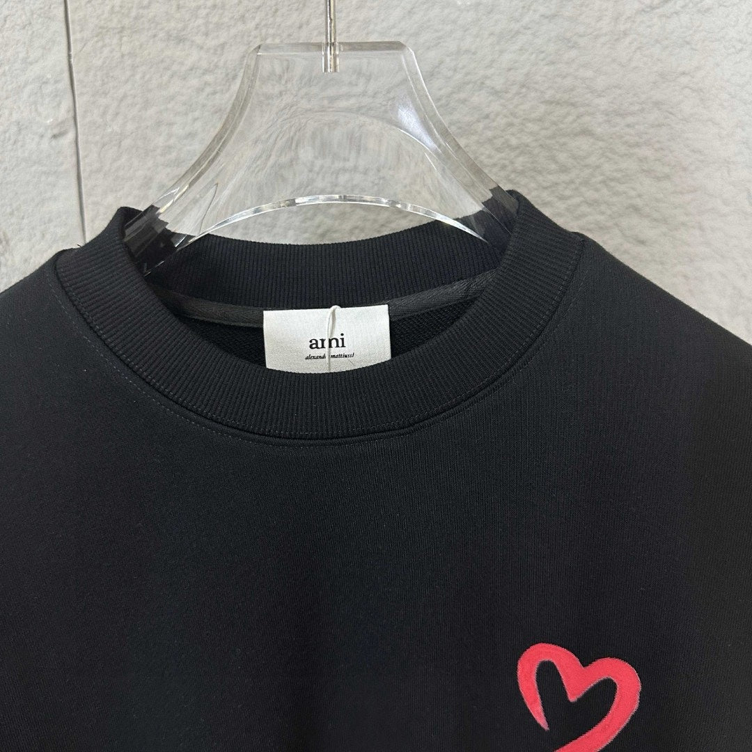 Amiri crewneck sweatshirt close-up of ribbed collar and red heart A emblem