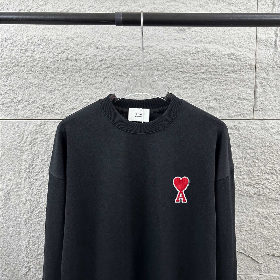 Amiri crewneck sweatshirt upper view, dark navy, red heart and A logo