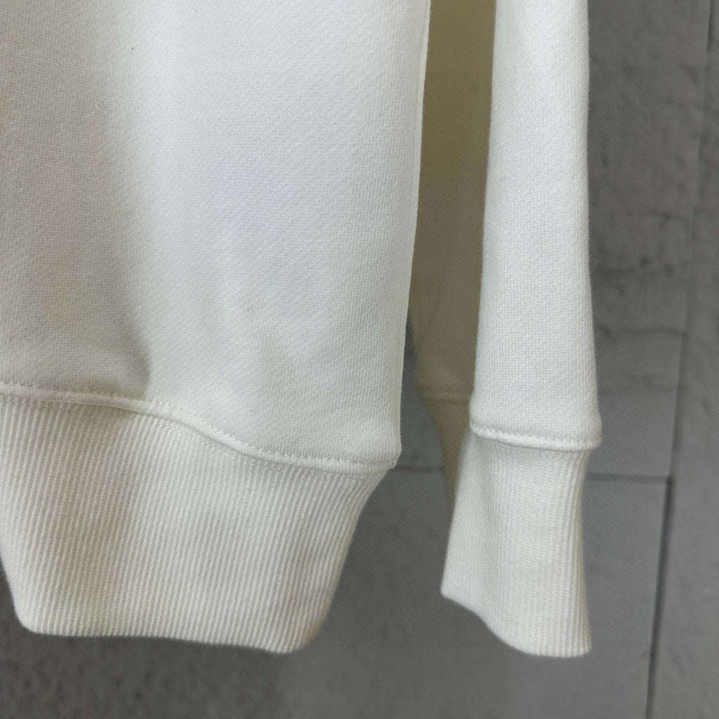 White sweatshirt sleeve with ribbed cuff and ribbed hem