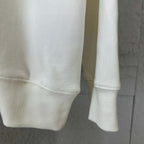 White sweatshirt sleeve with ribbed cuff and ribbed hem