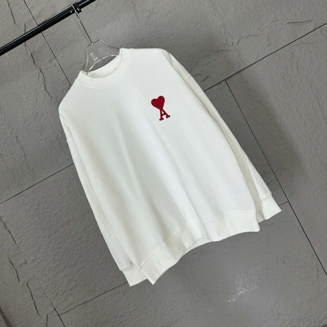 White crewneck sweatshirt with red heart emblem and small red A logo