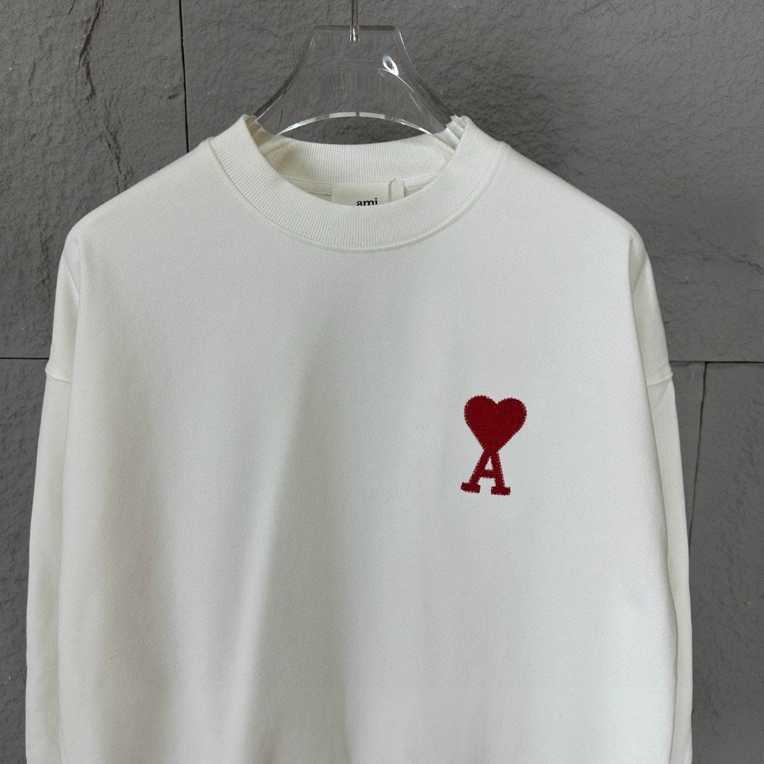 White crewneck sweatshirt front view with red heart and A logo