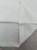 Burberry white T-shirt fold showing side seam and hemline
