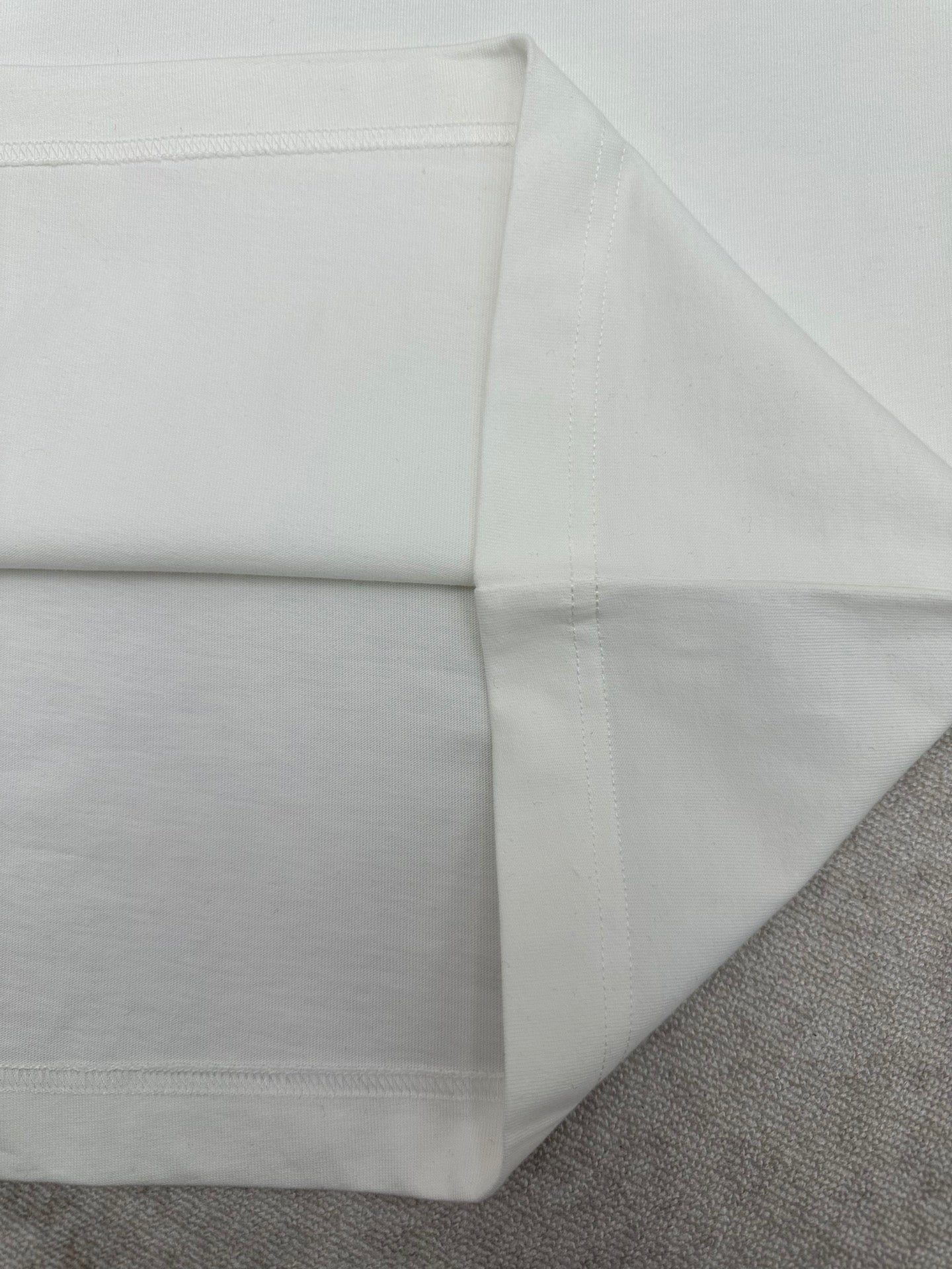 Burberry white T-shirt fold showing side seam and hemline