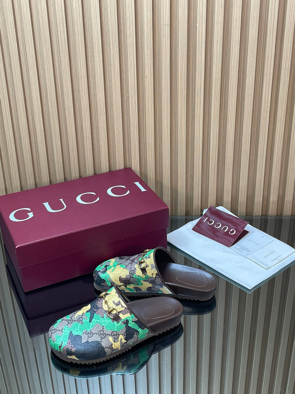 Gucci slide sandals with multicolor patterned strap, open toe, dark outsole