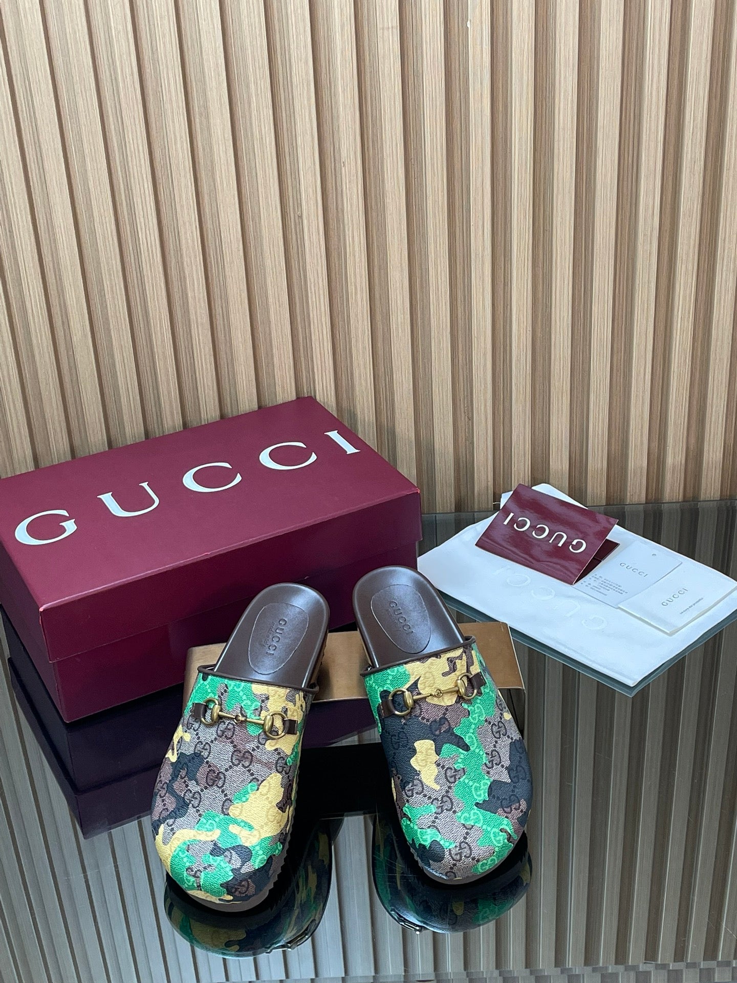 Gucci slide sandals with multicolor logo-pattern upper and gold buckle detail