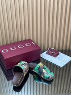 Gucci slide sandals, multicolor logo print with buckled strap and dark footbed
