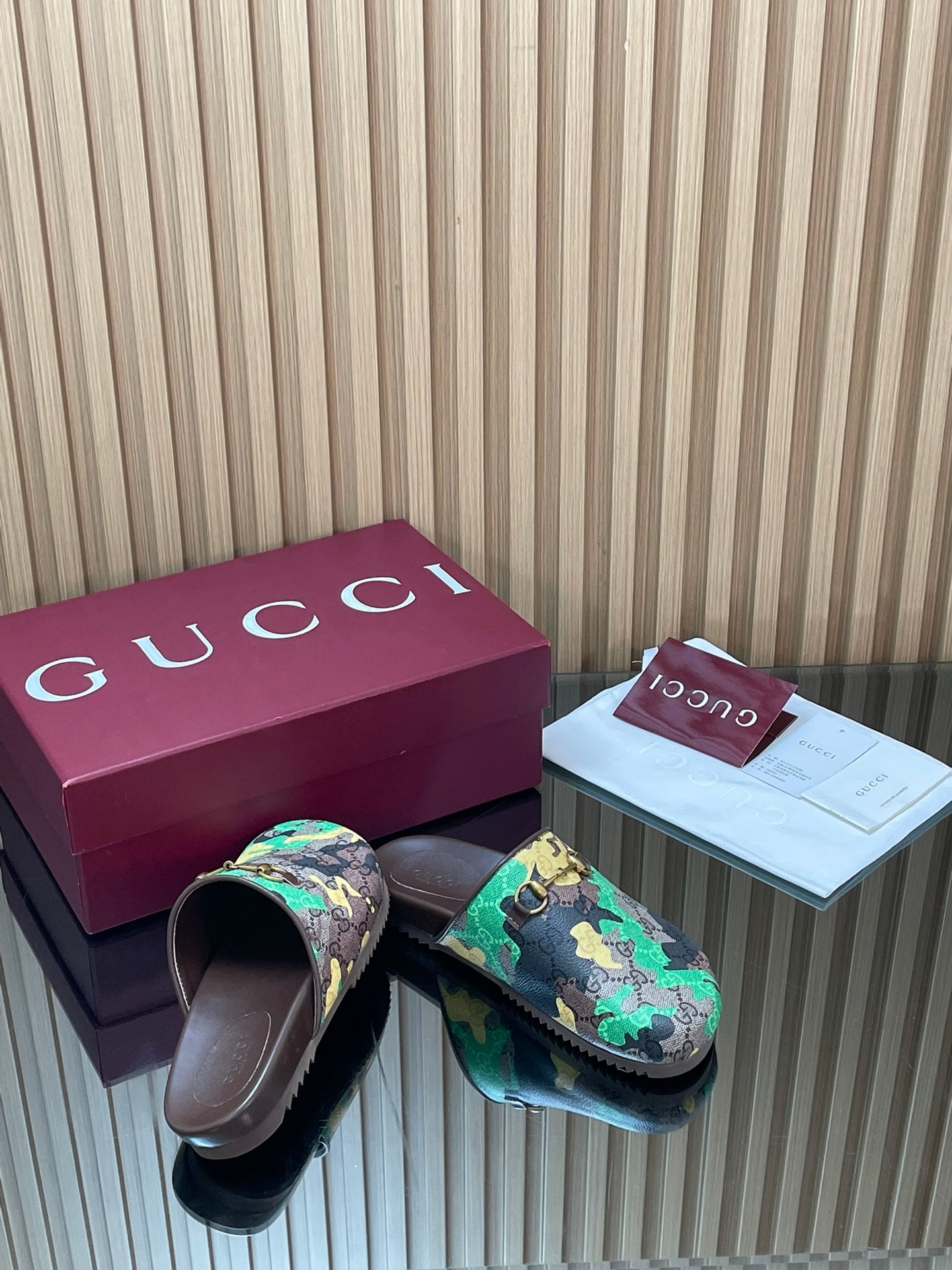 Gucci slide sandals, multicolor logo print with buckled strap and dark footbed