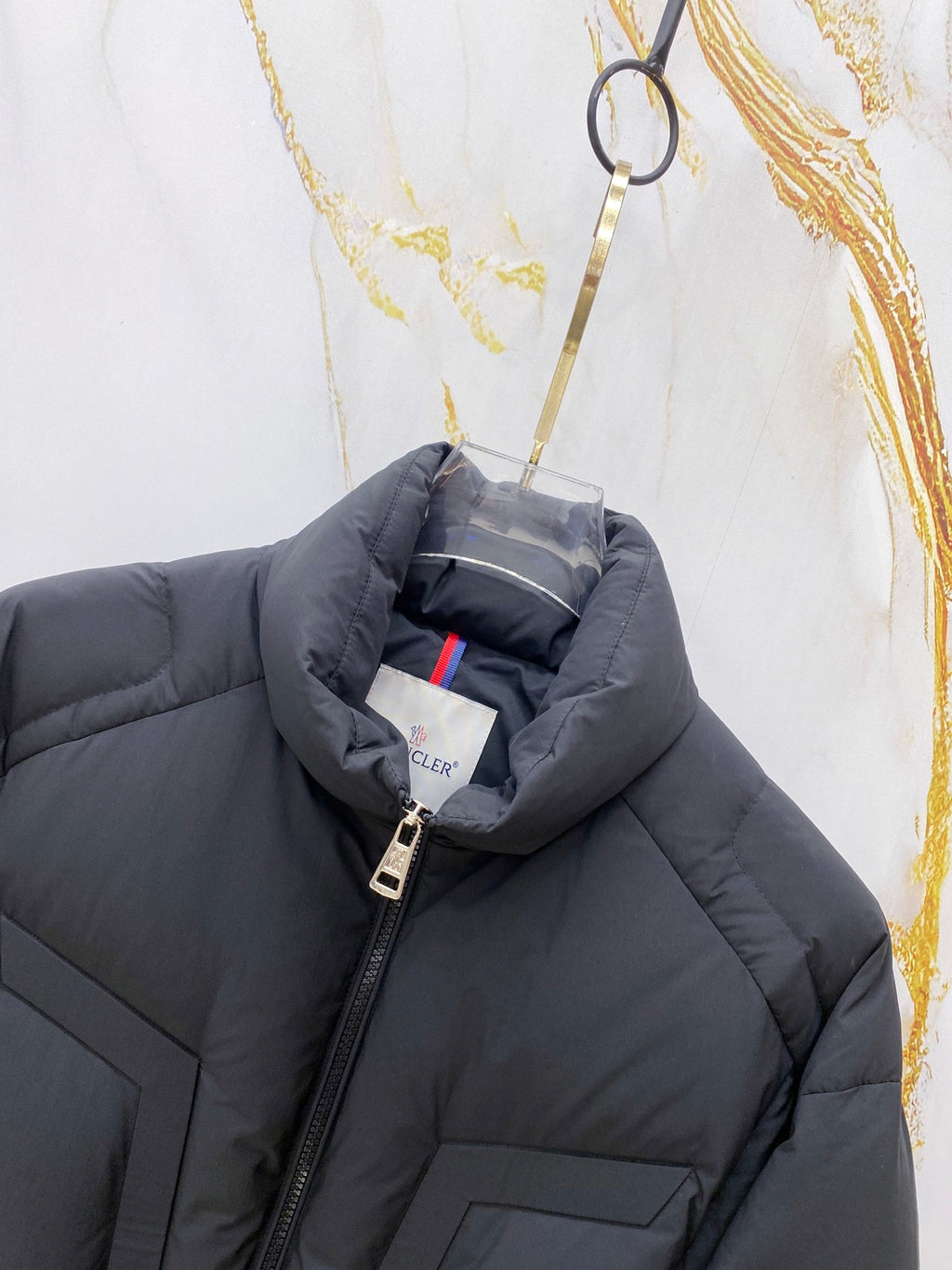 Moncler long puffer jacket interior view with zip and hood drawcord