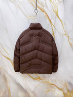 Long Moncler puffer jacket back view, dark brown quilted padding and yokes.