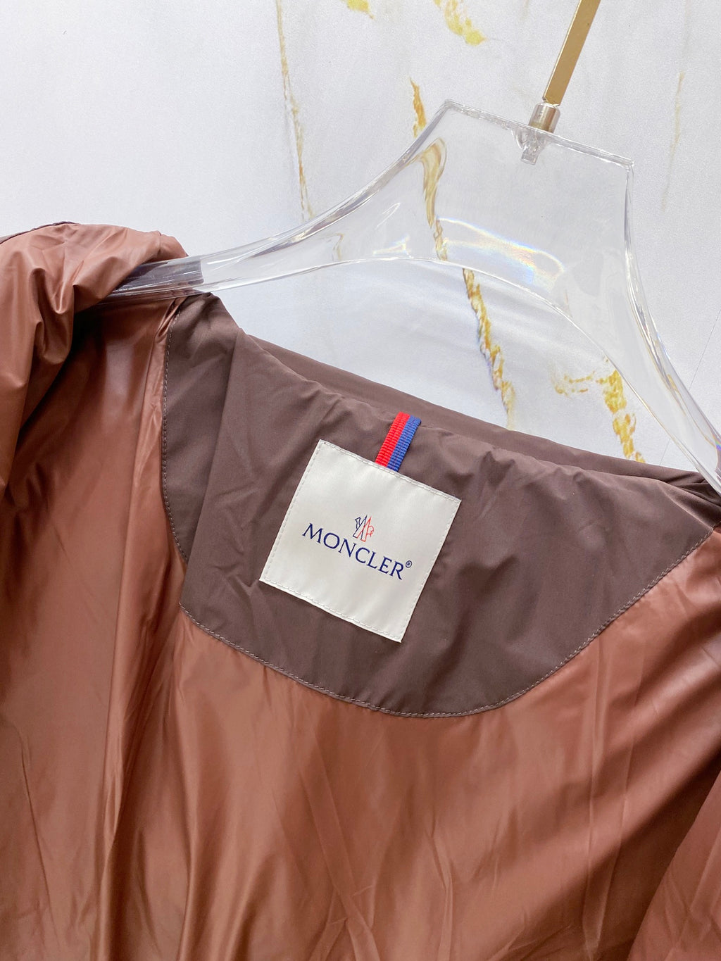 Moncler long coat in brown with front logo patch