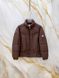 Long Moncler puffer jacket, dark brown, front zip and standing collar.