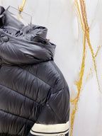 Long puffer jacket with striped knit cuff trim at the wrist