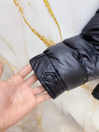 Puffer jacket sleeve cuff with snap button and gathered fabric