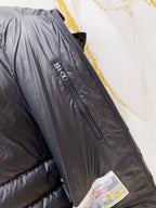 Long puffer jacket with front zip and sleeve badge patch