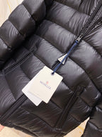 Quilted puffer jacket front with zipper and hanging product tag