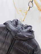 Long puffer jacket sleeve and shoulder with dark side zipper and button detail