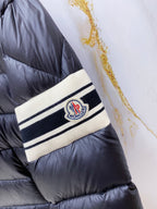 Long puffer jacket wrist band with Moncler logo patch and striped trim