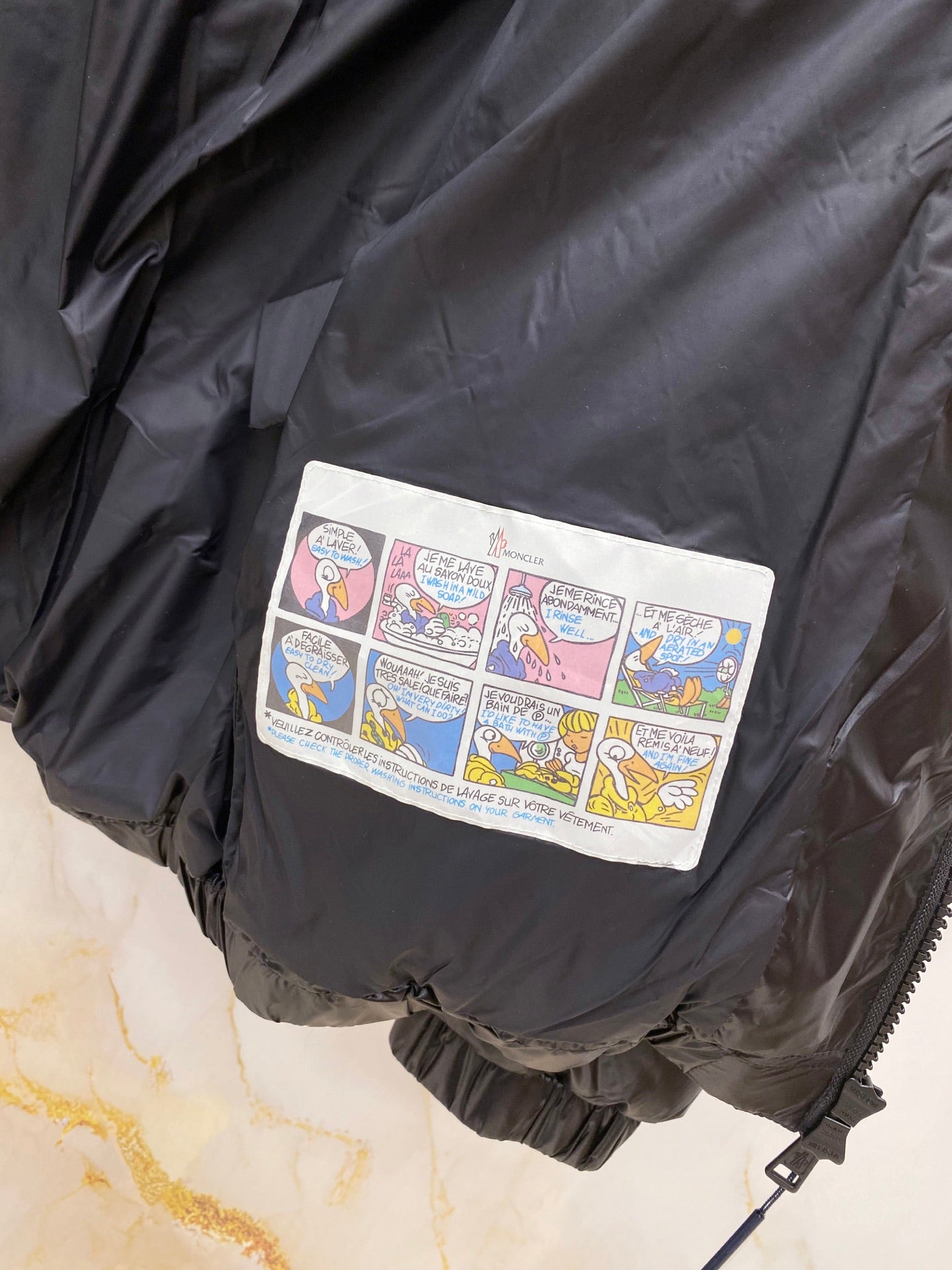 Moncler long puffer jacket with multicolor logo patch