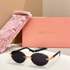 Round sunglasses with dark lenses and gold-tone frames, black temple tips
