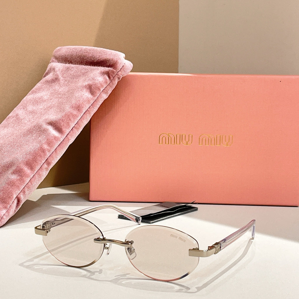 Round sunglasses with clear lenses and gold-tone frames, slim arms