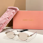 Round sunglasses with clear lenses and gold-tone frames, slim arms
