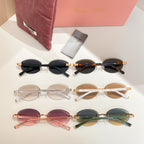 Assorted round sunglasses set with clear, brown, pink, and green lenses, gold-tone frames